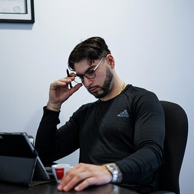 Coach K reviewing a client program